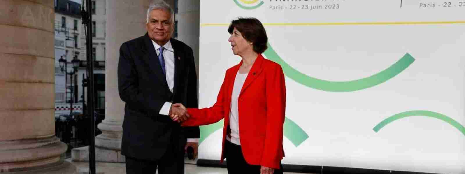 President in France for Global Financial Pact